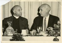 Alan Guttmacher with a priest