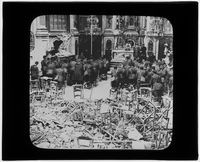 Soldiers praying in damaged cathedral
