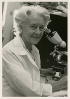 Lynne M. Reid with microscope