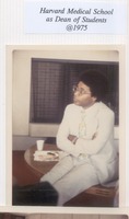 Poussaint 1975 at desk with legs up.tif