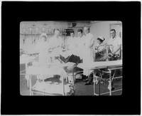 Nurses and doctors around an operating table