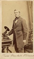 Oliver Wendell Holmes with his microscope