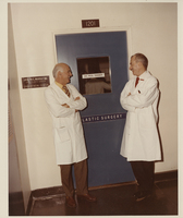 Dr. Murray and Dr. Tessier standing in front of the Plastic Surgery Unit at Children&#039;s Hospital
